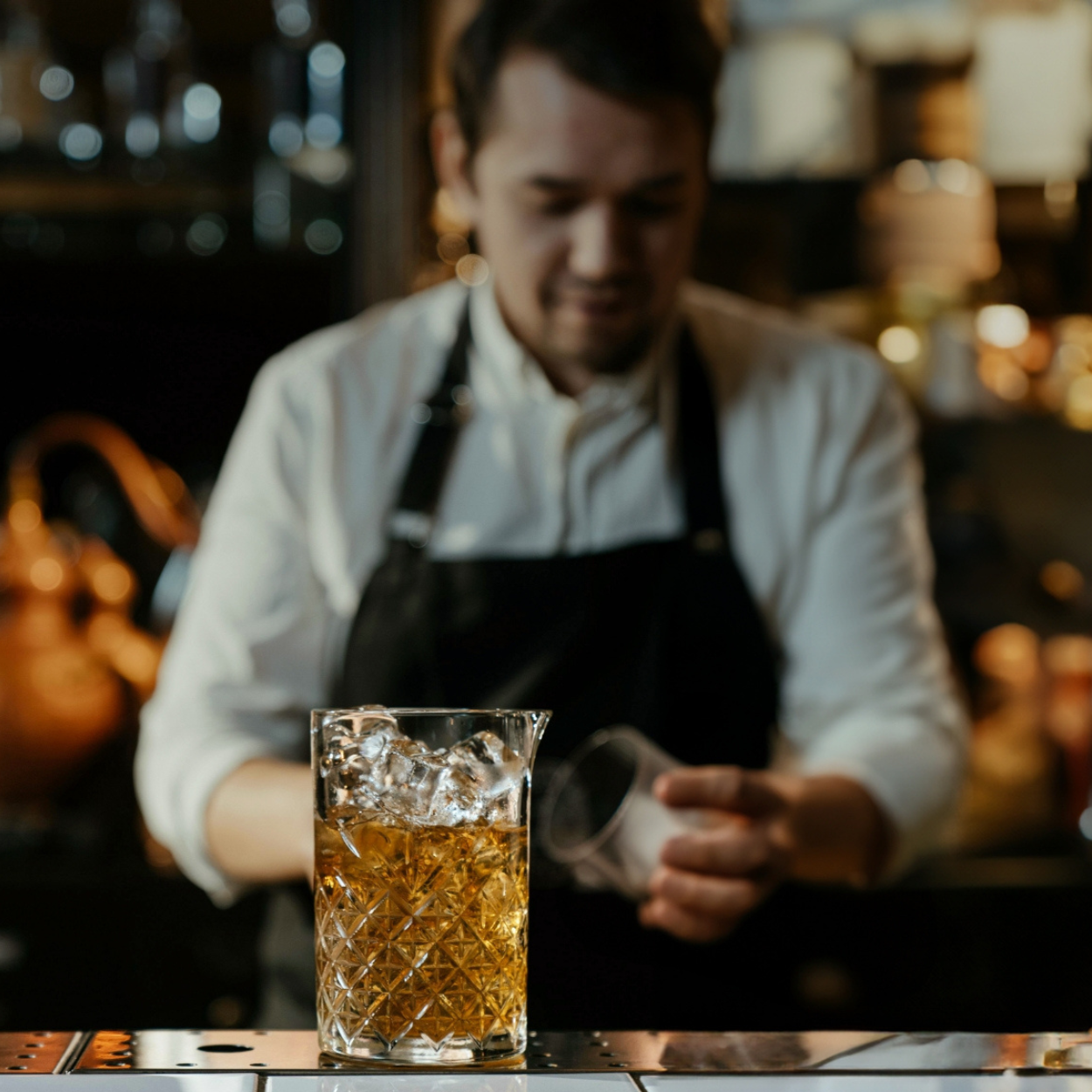 Bartender mixing a drink at Benfinita